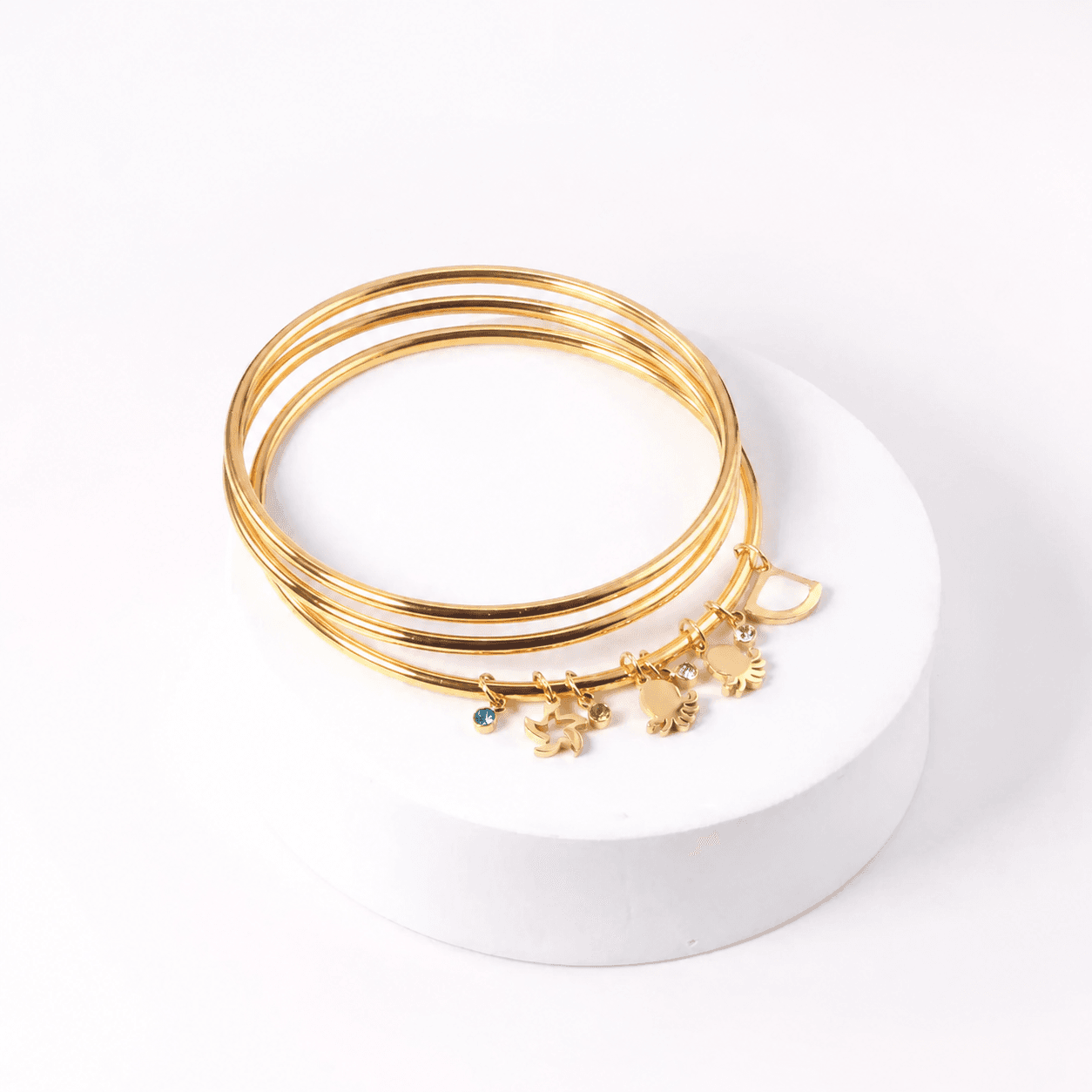 Set of Three Gold-Toned Bangles with Ocean-Inspired Charms